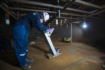 Male worker inspection floorscan tank