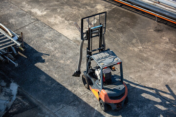 Forklift loader pipeline oil in storage warehouse business distribution products.