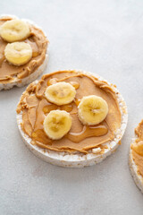 Peanut butter over rice cakes and honey. Healthy protein snack for breakfast
