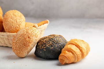 Assortment of freshly baked breads. Buns and croissants.