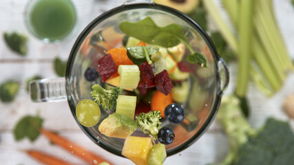 Fresh vegetables smoothie blended in blender, top view. Healthy eating concept.