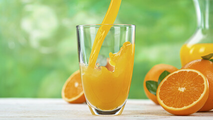 Fresh Orange Juice Being Poured in a Glass, Close-up.