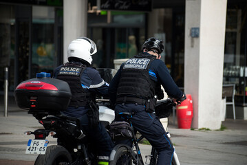 Mulhouse - France - 17 March 2022 - Portrait of french municipal policemen and motorbike and...