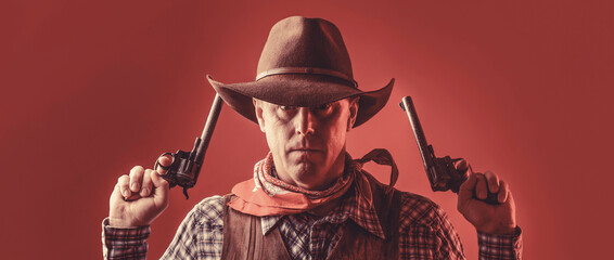 Man wearing cowboy hat, gun. Portrait of a cowboy. West, guns. Portrait of a cowboy. Western man with hat. Portrait of farmer or cowboy in hat