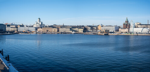 Fototapeta na wymiar Panoramic view of downtown Helsinki with the lutheran cathedral, presidential palace and the market square in the sight.