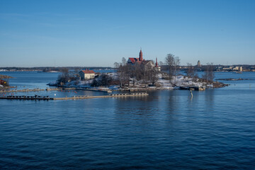 A view from the south harbor towards the sea. An old mansion in the middle of Helsinki.