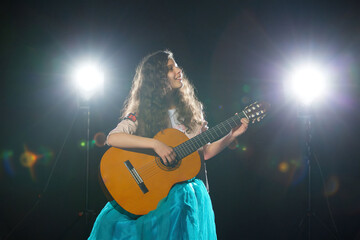 Obraz premium Charming little girl performs at a solo concert