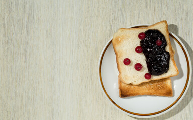 Toasts with jam on natural fabric background
