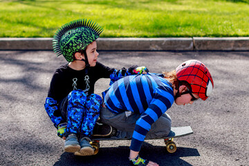 Brother having fun skate boarding