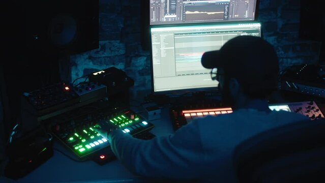 Music producer working in the studio on musical beat