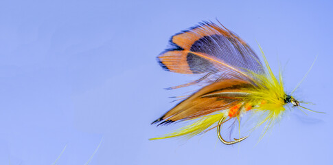Self-tied fishing lures, flies for fly fishing studio shots with copy space
