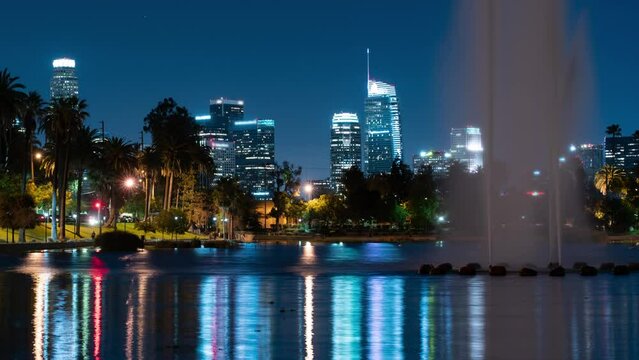 Los Angeles Downtown Skyline Reflections on Echo Park Lake Tilt Up Night Time Lapse California USA