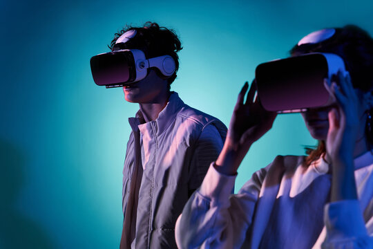 Couple exploring virtual reality in studio