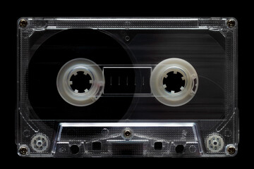 Old vintage audio cassette isolated on black background. Retro analog hifi music concept