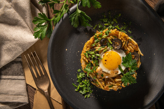 Portuguese cuisine - Frango a Bras. Traditional Portuguese dishes, based on saut&eacute;ed chicken with onion, garlic, parsley, olives, egg and potatoes chips. A variation of the traditional Bras cod dish