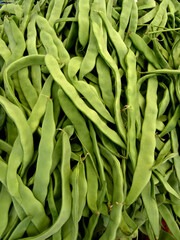 Fresh, organic runner (or flat) beans (Phaseolus coccineus in Latin) on a farmers market stall in...