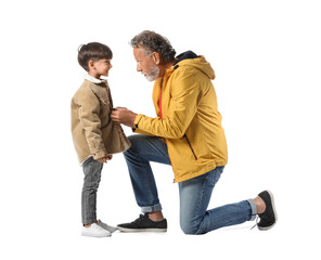 Obraz premium Little boy and his grandfather in warm jackets on white background