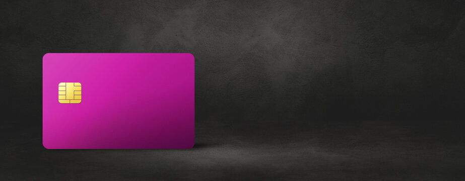 Pink Credit Card On A Black Concrete Background