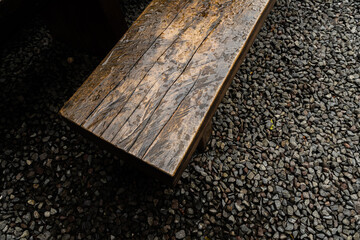 a wet wooden bench after rain