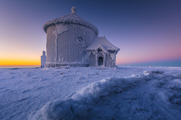St. Lawrence Chapel on the top of Śnieżka in the Karkonosze Mountains. Winter view of the...
