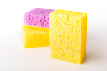 Sponges for washing dishes on a light background. Close-up