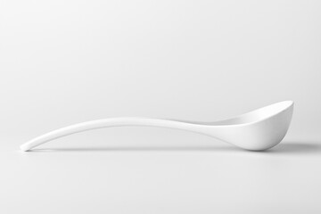 White ladle for soup on a white background. The concept of kitchen utensils or tool. copy space for text