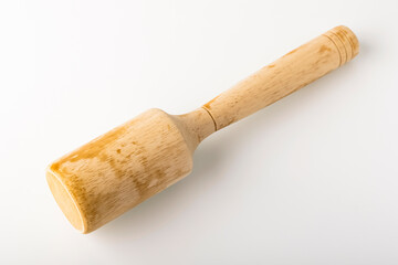 Wooden pusher for mashed potatoes. Kitchen tool concept - obrazy, fototapety, plakaty