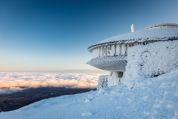 Winter view of the Meteorological Observatory on Śnieżka in the Karkonosze Mountains. The...