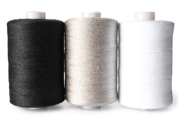 Fototapeta na wymiar Multicolored sewing thread spools on white background