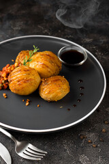 Crispy Accordion Potatoes with sauce and vegetables