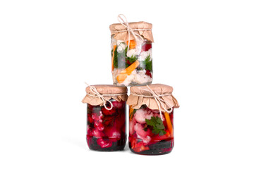 Cauliflower pickle with beetroot, marinated cauliflower pickles in jars on white  isolated background.