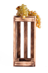 Empty wooden box of wine and bunch grapes.