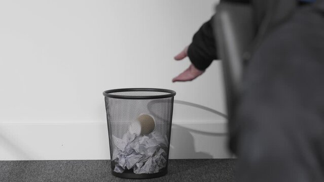 Wide Shot of Person Throwing Coffee Cup into Bin