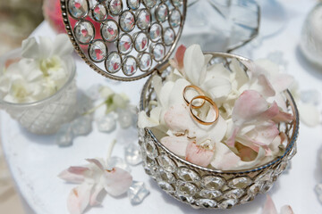 Beach wedding ceremony on a tropical island. 
Wedding paraphernalia in nude shades, tropical light...