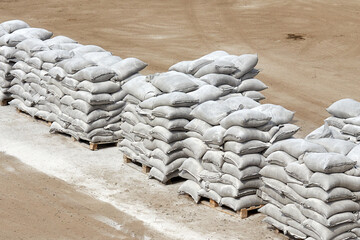 bags of flour on pallets in the yard of the warehouse