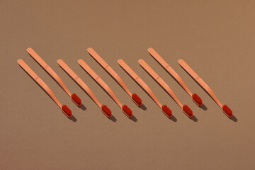 Set of tooth brushes on light background