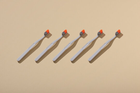 Set of tooth brushes on light background