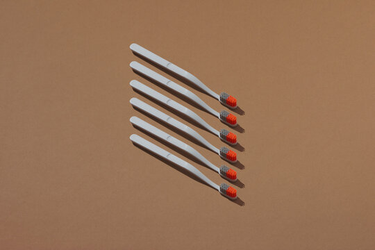 Tooth brushes on brown background