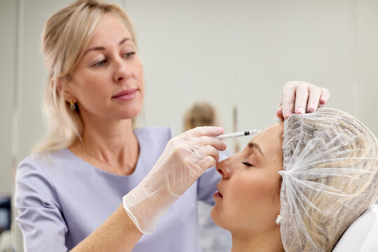 doctor giving face lifting injection