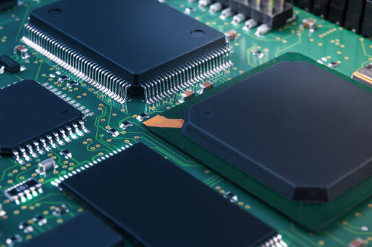 Electronic Circuit Board With Passive And Active Circuit Components And IC Close-up