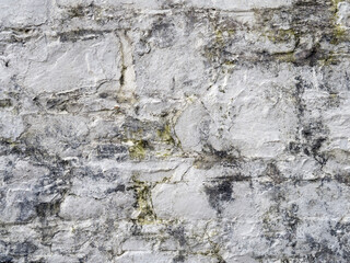 Obraz na płótnie Canvas Old white, painted stone wall background.