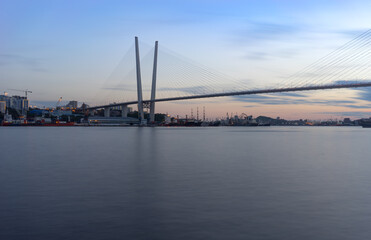 Fototapeta na wymiar Urban landscape with views of the Golden bridge in the evening.
