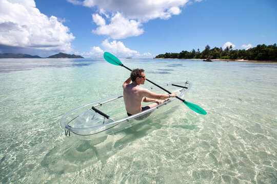 adventure travel, kayak on tropical beach in Seychelles