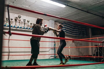 Determined boxers training in ring