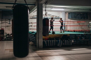 Determined boxers training in ring