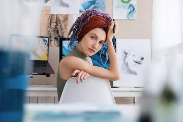 Female illustrator taking break during work