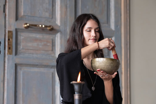 Female enjoying sound of Tibetan bowl