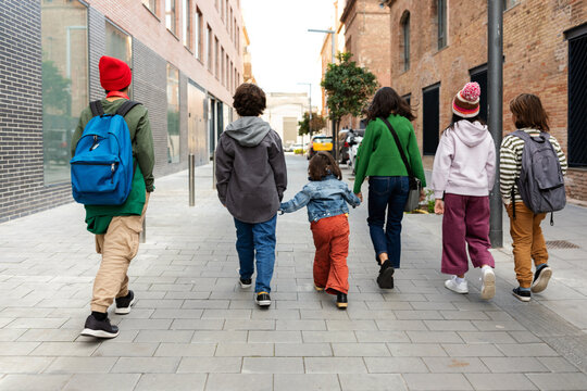 Children leaving school by the city
