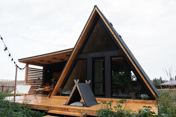 Tent on terrace of triangle house