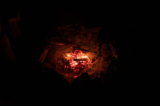 Charcoal burning in fire pit
